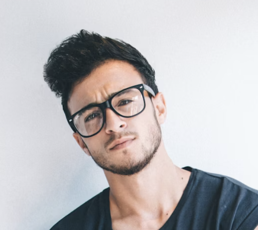 Man with glasses looking at camera